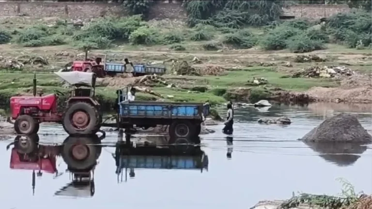 Tractors engaged in illegal sand mining inside Bhogavo riverbed Surendranagar